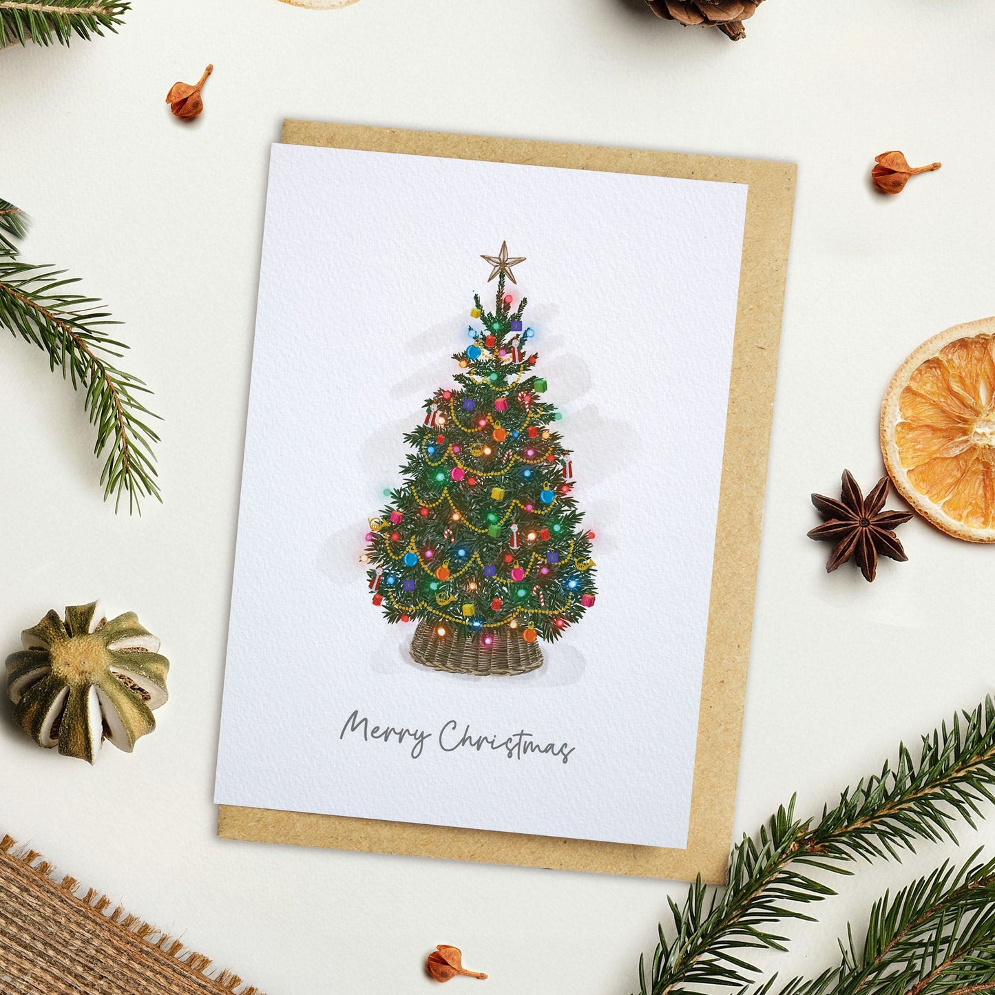 Christmas card with a decorated tree design surrounded by festive elements on a white background